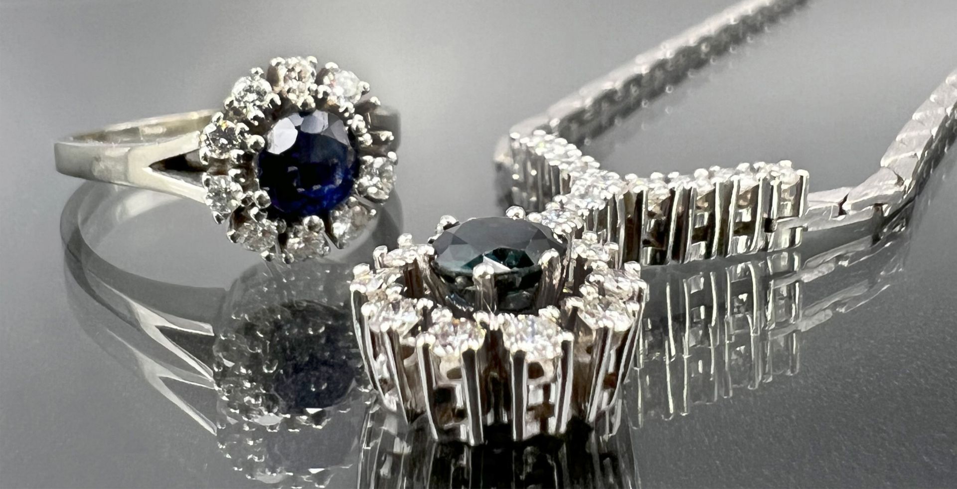 Jewellery set 585 white gold. Necklace and ring with sapphires and diamonds.