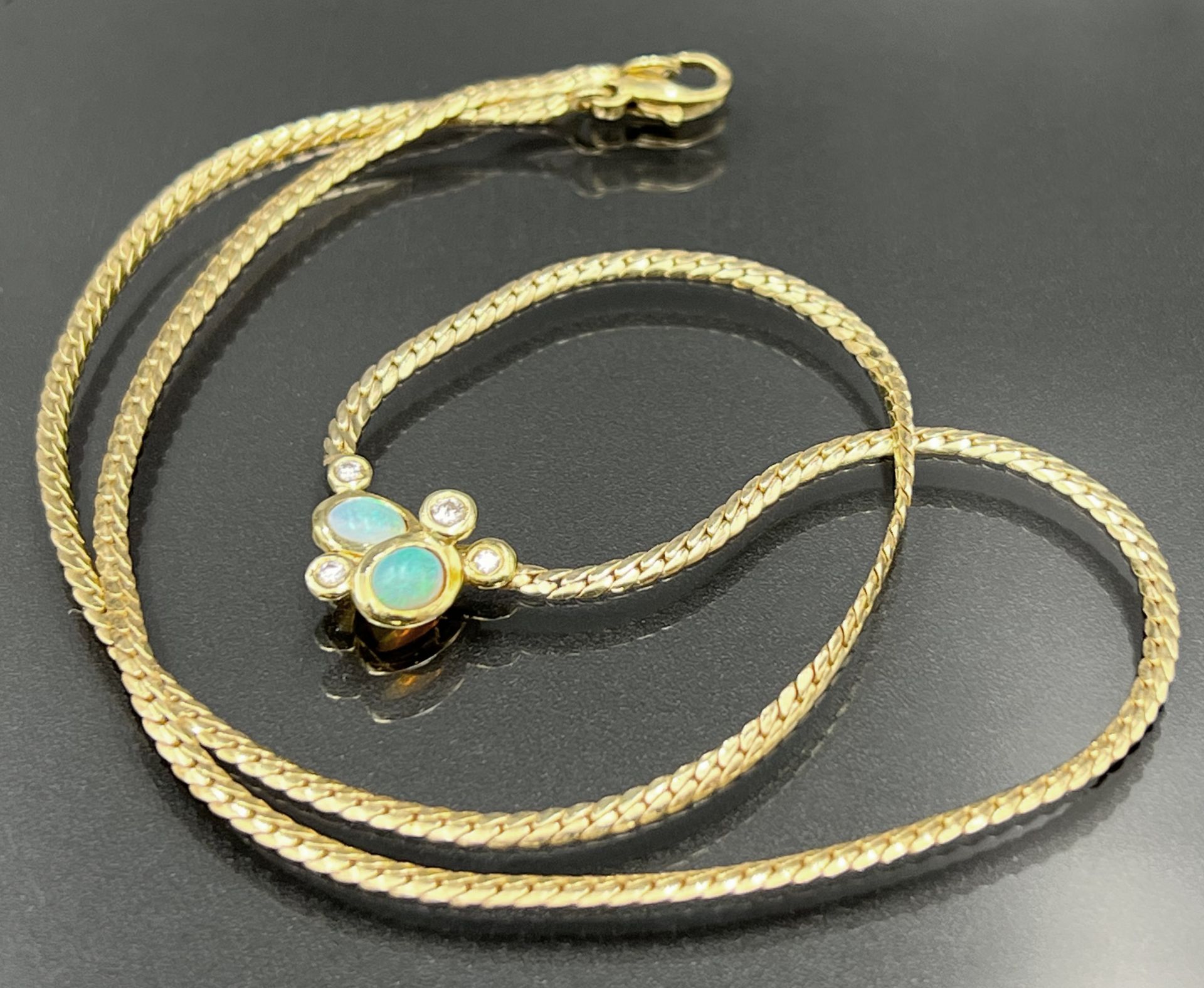 Necklace 585 yellow gold. Centre piece set with small opals and diamonds.