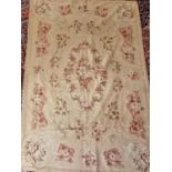 An Aubusson design Rug/Wall Hanging with cream ground and floral design.