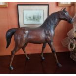 An early 20th Century magnificent large Leather figure of a Horse. L 67 x H 59 cm approx.