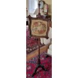 A 19th Century Rosewood pole Screen with tapestry panel on tripod support.