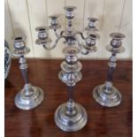 A Silver Plated four branch Candelabra along with a set of three single Candle Sticks.