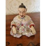 A good early Oriental hand painted novelty Figure of a seated man. W 15 x 16 cm approx.