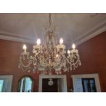 A magnificent eight branch Crystal and metal Chandelier with crystal dops and swags. W 68 x D 85