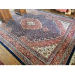 A very large blue ground Hindu Persian Carpet with medallion design and multi borders.