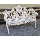 A superb very heavy cast Iron garden Bench with Oak leaf decoration and dog head arms.