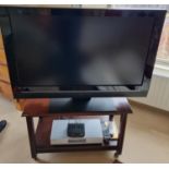 A Tevion 40'' flat screen HD LCD Television with Stand. Dose not come with two boxes below.