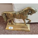 A good Brass door Stop in the form of a Horse trotting.