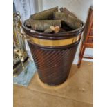 A good Irish Peat/Log Bucket with brass rim reeded ribbed outline and two brass lifting handles. D