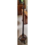 A late 19th early 20th Century Mahogany Standard Lamp on turned platform base and fluted support.