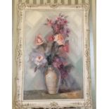 A large 20th Century Oil on Canvas still life of Roses in a vase. Signed Rollo LR. In a good painted