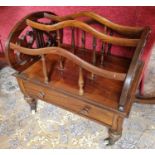 A 19th Century Rosewood three division Canterbury on turned supports and brass castors, with