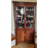 A 19th Century Mahogany Corner Cabinet with twin astragal glazed upper doors, a twin panelled base