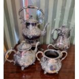 A 19th Century Silver Plated Tea Service with highly embossed outline. Coffee Pot H 26cm approx.