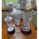 A good Waterford Crystal Vase on a timber stand along with a large bon bon dish and another, both