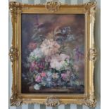 An early 20th Century Oil on Canvas still life of flowers in a vase on a table setting. Signed C