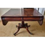 A Magnificent Irish early Regency Mahogany Sofa Table with rosewood crossbanding and carved acanthus