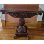 An early 19th Century Mahogany foldover Card Table, possibly Irish, with hairy paw feet turned