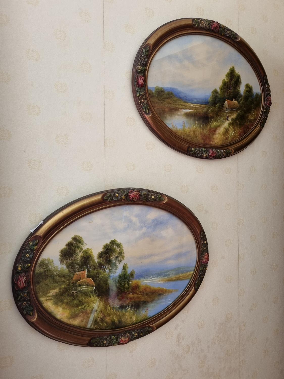 A 19th Century Oil on Paper of a country scene of lake and river. In an unusual oval gilt and