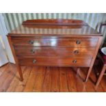 A late 19th Century Mahogany and Inlaid Lowboy on square tapered supports and brass castors. 105 x