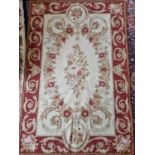 An Aubusson design Rug/Wall Hanging with red and cream ground.