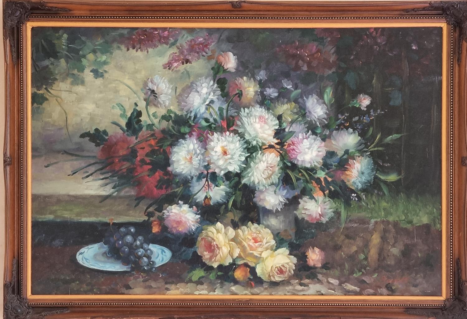 A large Oil on Canvas still life of flowers in a vase on a table setting. Signed LR. Bennett. Well