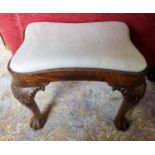 A 19th Century Irish Footstool with hairy paw feet and concave outline. W 52 x 36 x H 44 cm approx.
