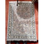 A pink and cream ground Rug. 130 x 86cm approx.