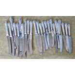 A set of twelve Silver handled table Knives along with a set of twelve Silver handled desert Knives.