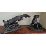 A Figural group of a Hound along with a bronze effect figure of a fox and a Genesis figure of a