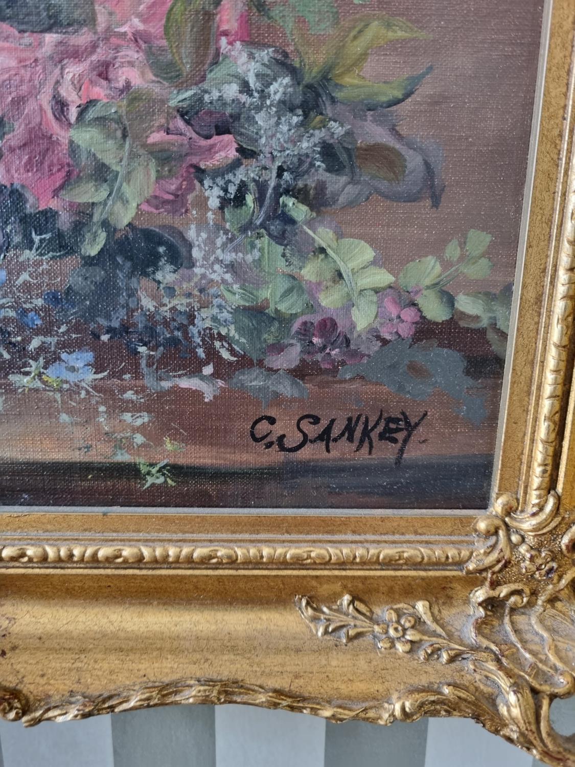 An early 20th Century Oil on Canvas still life of flowers in a vase on a table setting. Signed C - Image 2 of 3