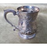 A Georgian London Silver embossed Tankard 1783. 227 gms. approx.