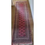 A good pink and red ground Runner with multi borders and repeating medallion design. 280 x 80cm
