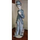 A Lladro figure of Charlie Chaplin. H 28 cm approx.