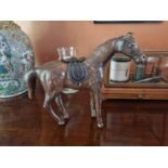 A good early leather Figure of a Horse with saddle. L 36 x H 27 cm approx.