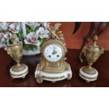 A really good 19th Century Bronze and Ormolu Clock Garniture with white dial face on a white