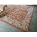 A full pile Turkish Ziegler style Carpet with all over floral field in Terracotta and with a Cream