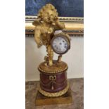 A really good 19th Century Ormolu and Marble Clock with a good enamel dial depicting a cherub