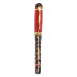 DELTA "MAASAI" FOUNTAIN PEN 2003 EDITION .Marbled resin barrel with brown barrel and red cap and