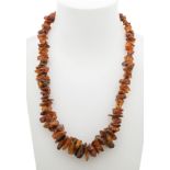 Amber necklace with a row of irregular, tapering beads.Weight: 94.2 g.Measurements: 66 cm (length).