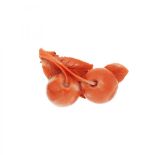 Corallium brooch in the shape of cherries.Japanese coral brooch in the shape of cherries carved from