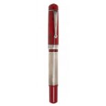 DELTA "NAITILUS" FOUNTAIN PEN.Red resin barrel and rhodium plated steel ornamentation and body.