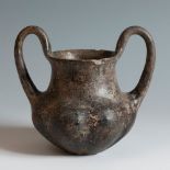 Two-handled impasto vessel from the Villanovan culture, 750-650 BC.Terracotta.Provenance: private