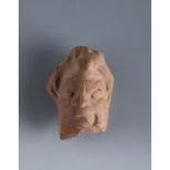 Head of a faun. Smyrna, 3rd century BC.Terracotta.Provenance: Smyrna, 1895-1905. Collection Paul