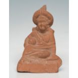 Female figure; Egypt, Roman Period, Alexandria, 1st century AD.Reddish terracotta.Size: 11 x 7.5 x