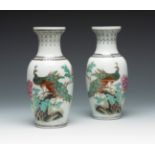 Pair of Rose Family vases. China, second half of the 20th century.Hand-glazed white porcelain.With
