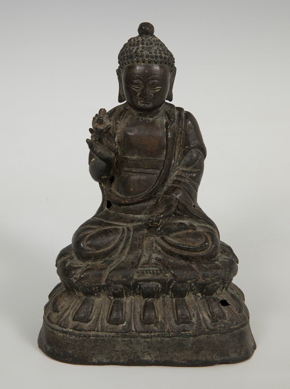 Buddha. China, Ming Dynasty, 1368-1644.Metal.It has a perforation.It shows inscriptions on the