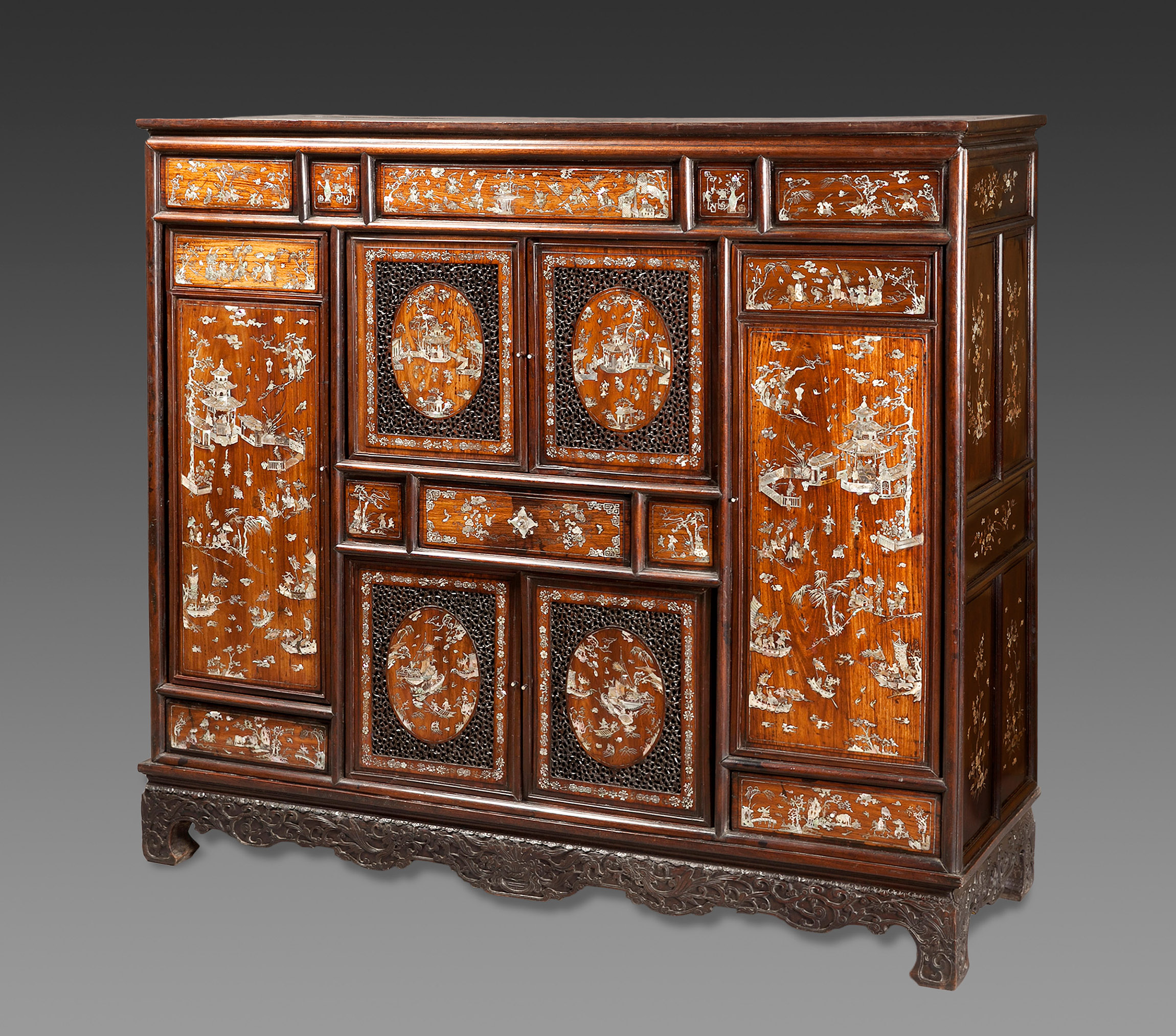 Important Chinese cabinet; Qing Dynasty, circa 1720-30.Rosewood with mother-of-pearl inlay.