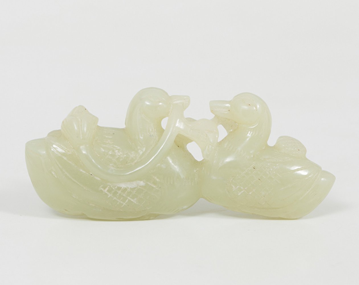 Amulet. China, Qing Dynasty, 20th century.Carved white jade.Measurements: 3.5 x 8 x 1.5 cm.Amulet