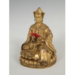 Sculpture. Tibet, 19th century.Gilt bronze.Slight wear on the surface.It has a flower engraved on